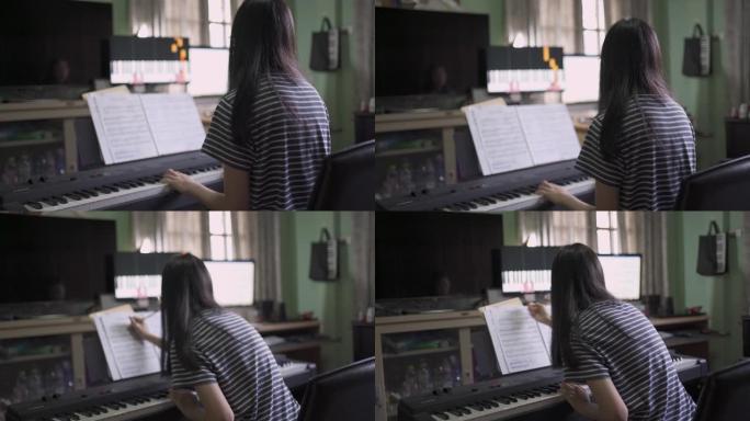 检疫少女学习如何在互联网上弹钢琴在线课程