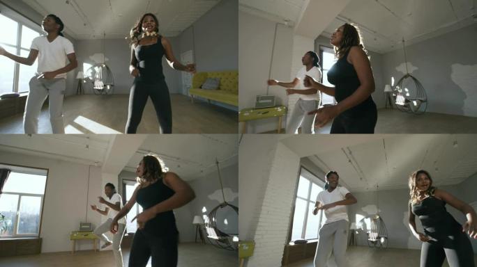 黑人男女练习非洲家庭舞蹈