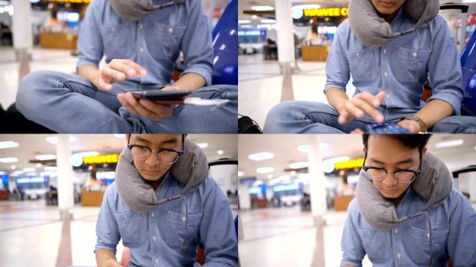 4k倾斜亚洲男子手持护照和智能手机，等待机场延误航班