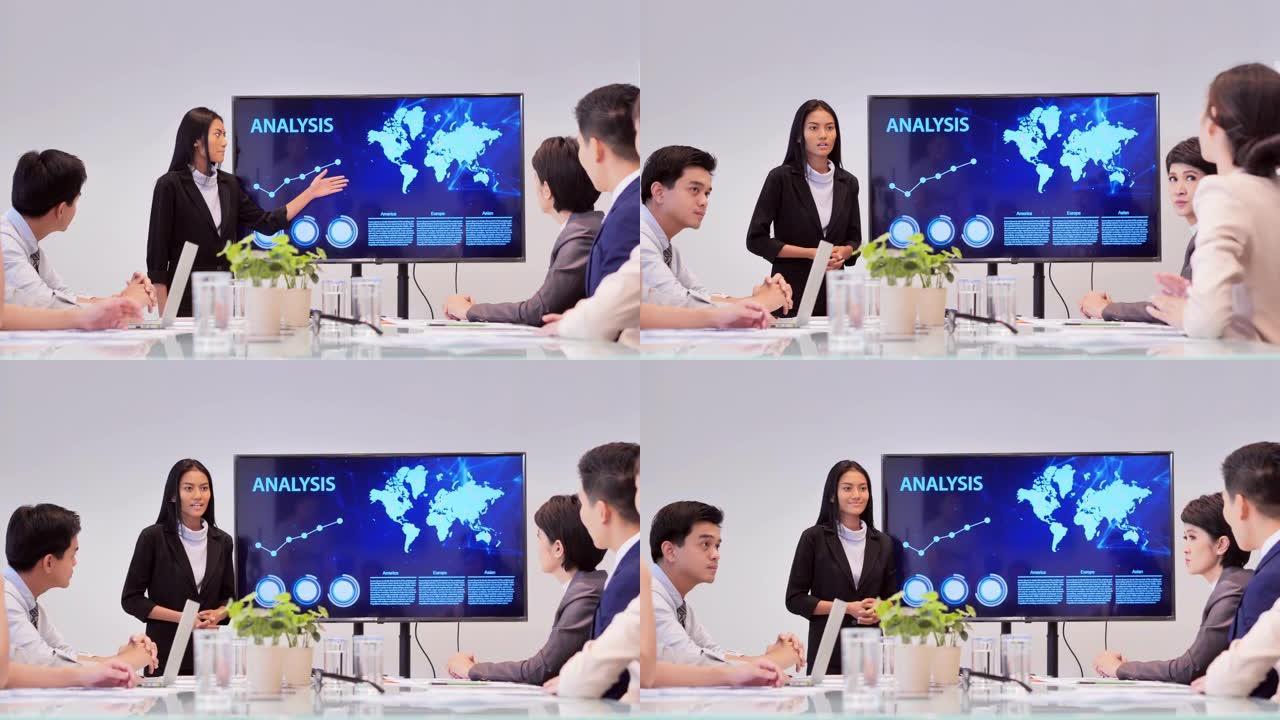 女商人团队负责人在办公室的数字交互式白板上展示想法的项目策略。业务，人员，教育，成功，领导力，团队合