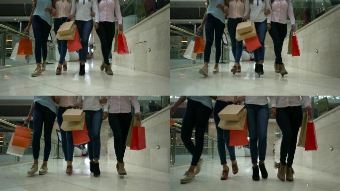 商场里面目全非的女朋友拿着购物袋走来走去的特写