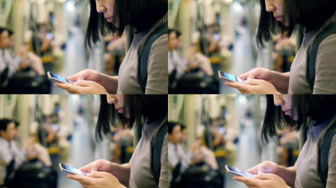地铁里的女人用手机