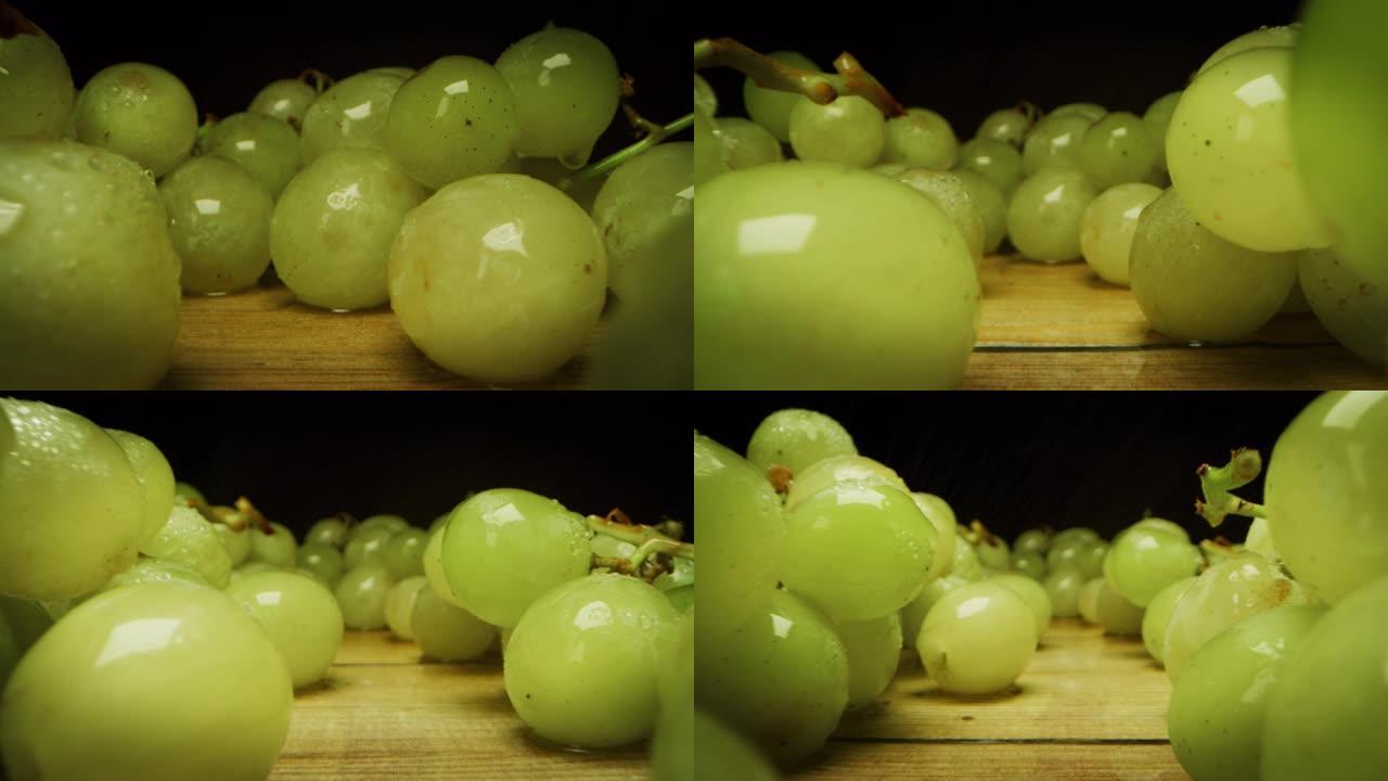 在慢动作的木凳上拍摄葡萄的超级宏观幻灯片。