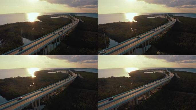 WS汽车在美国佛罗里达州佛罗里达礁岛日落时沿着七英里大桥行驶