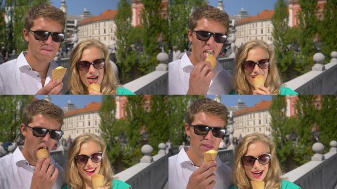 肖像: 快乐的旅行者夫妇在探索卢布尔雅那时吃冰淇淋。