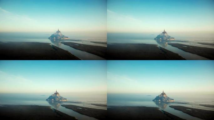 大气电影空中拍摄的大雾日出圣米歇尔山涨潮，诺曼底著名的岛屿要塞。