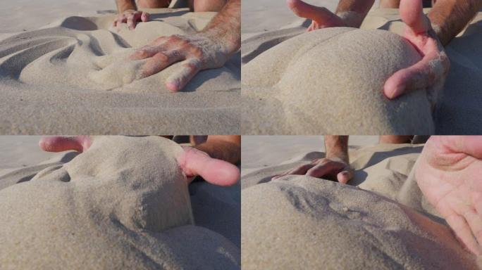 男人手中的沙子。慢动作。