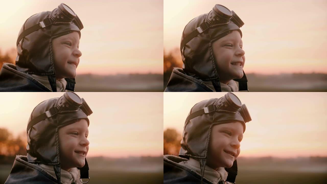 穿着旧飞行员服装的有趣小男孩的特写镜头，围巾和眼镜在野外慢动作中做出愚蠢的面孔。
