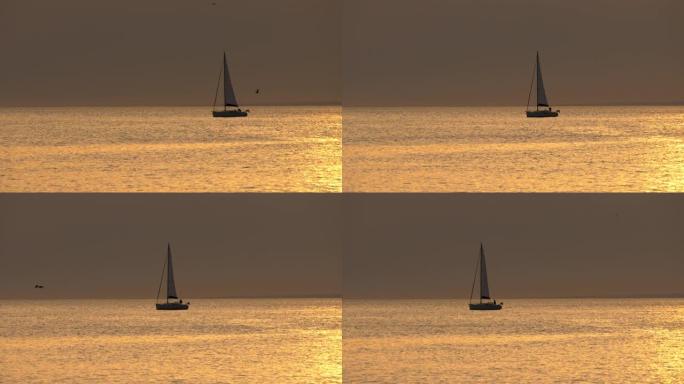 美丽孤独的yacth在日落时航行。UHD, 4K