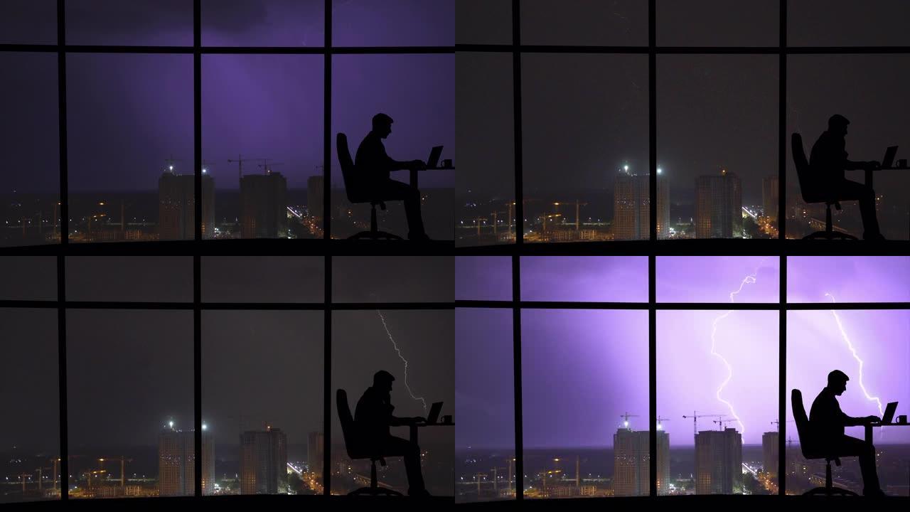 该男子在具有闪电背景的城市的全景窗户附近工作