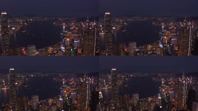 夜间从无人机鸟瞰香港城市景观。在办公楼和摩天大楼上空飞来飞去。