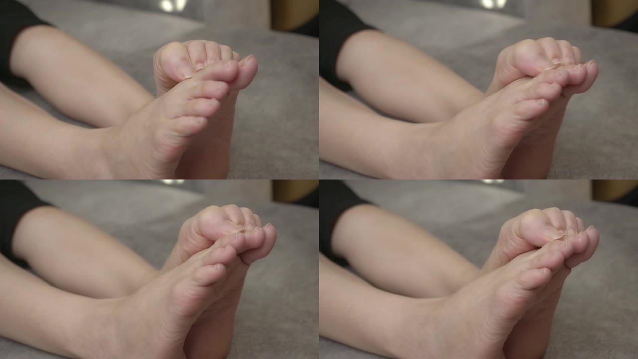 亚洲妇女感到脚痛足癣脚痒脚挠痒特写