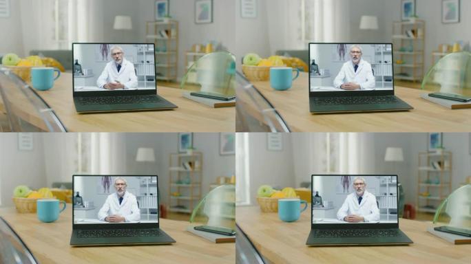 在家里的木桌上拍摄现代笔记本电脑，上面播放医疗视频。智能手机躺在电脑旁边的桌子上。