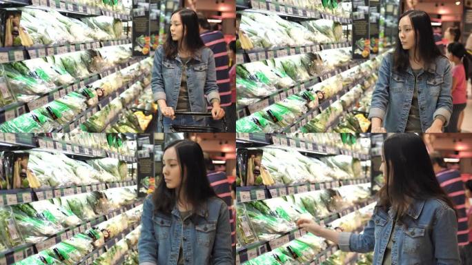 超市里的亚洲女人商城商场店铺女子买东西