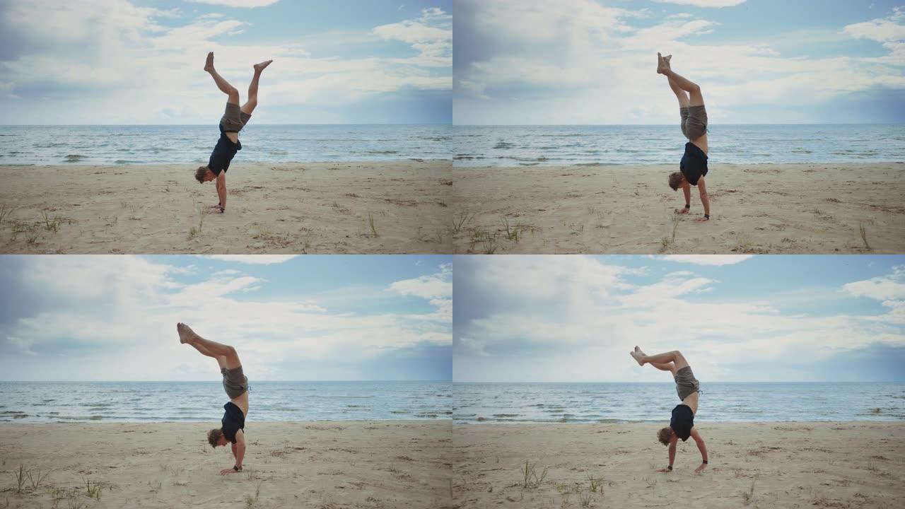 英俊的男性年轻人正在海滩上享受生活。他在蔚蓝的大海景观附近跳着走。这是大自然温暖的晴天。