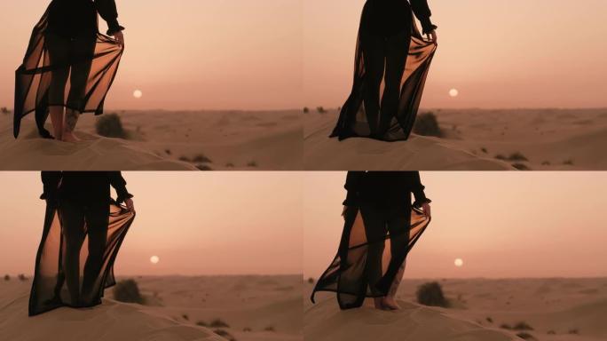 女人在沙漠里看日落