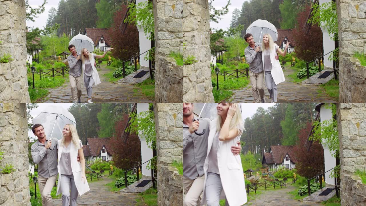 夫妇在雨天在乡下散步