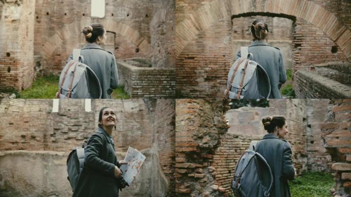 带着背包和地图探索意大利奥斯蒂亚古代遗址的兴奋的年轻女学生研究员的后视图。