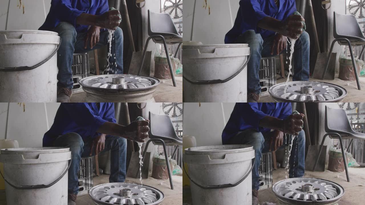 非洲男子清洁车轮