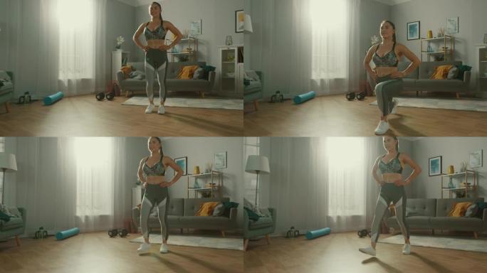 穿着运动服的强壮自信的运动健身女孩正在她阳光明媚、宽敞的客厅做向前的弓步运动，室内简约。