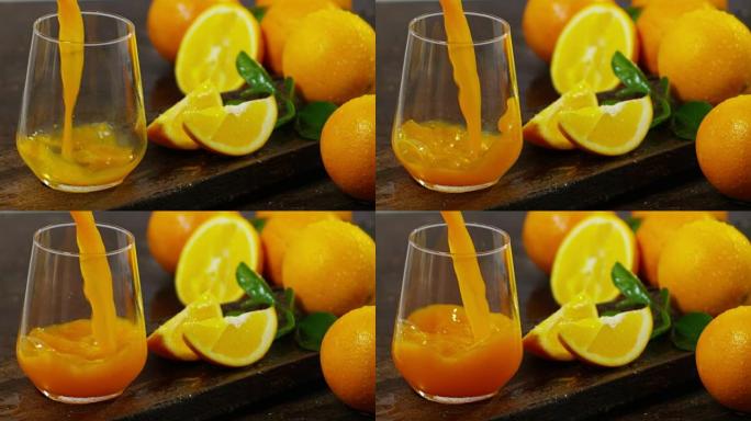 一只手倒入橙汁生物，鲜榨橙汁到mano。Il富含维生素和矿物质。橙汁非常适合饮食，早餐可以使一天充满