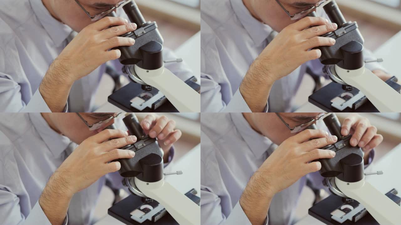 男性科学家在实验室工作。在生命科学实验室工作的卫生保健研究人员。