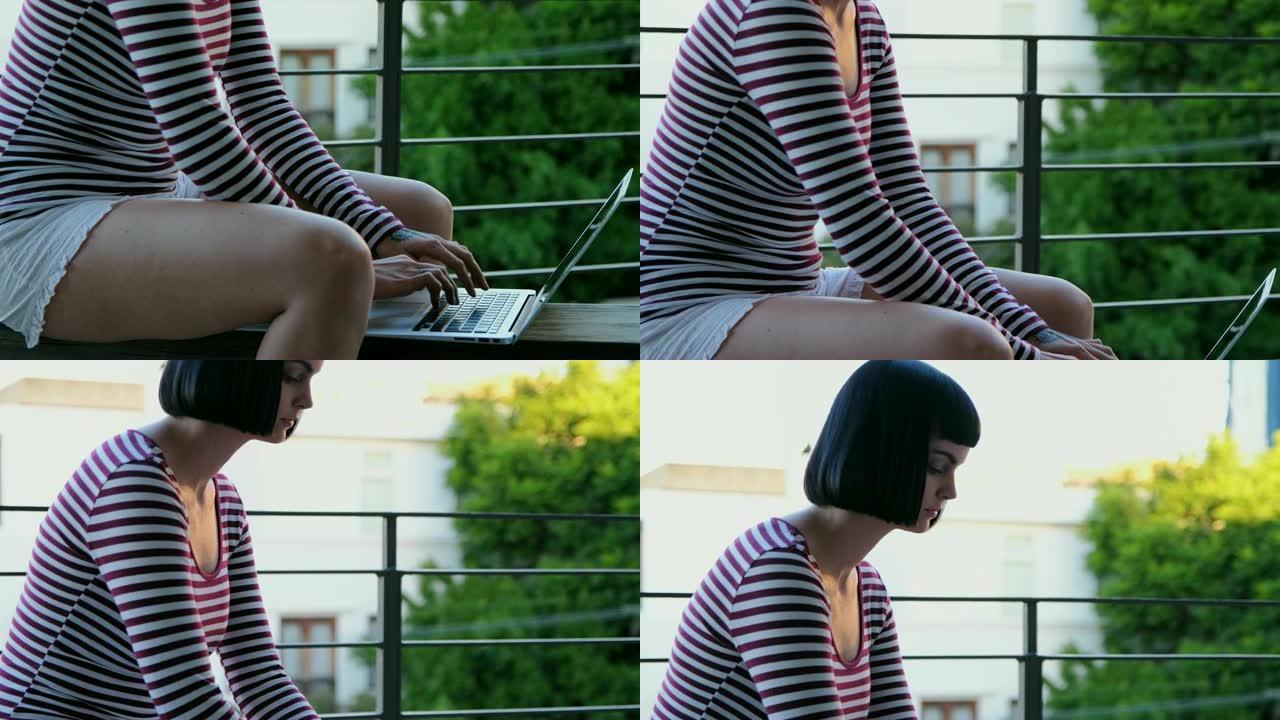 女人在阳台上使用笔记本电脑4k