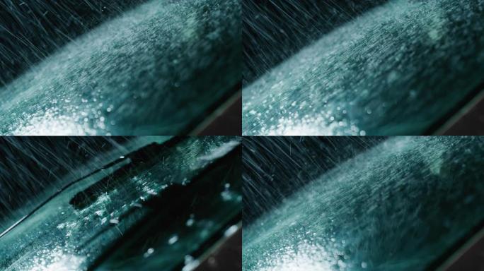 超级慢动作，在下雨的时候关闭一个玻璃，雨刷正在把水从它上面取下来。