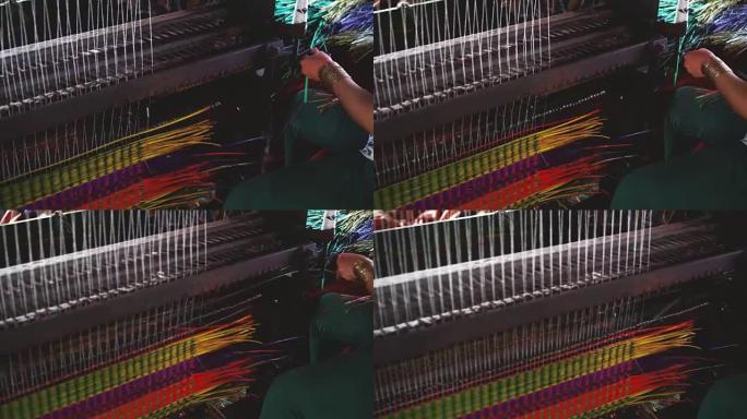越南工匠使用垫子编织机的4k镜头越南传统村庄的传统越南垫子，越南东塔，传统和制造概念