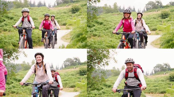 英国湖区野营度假期间，年轻家庭在乡间小路骑山地自行车玩得开心