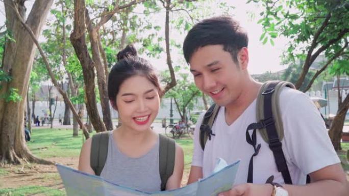 泰国曼谷地图上的亚洲旅行者夫妇方向，甜蜜的亚洲夫妇在度假旅行时在地图上寻找地标。生活方式夫妇在城市概