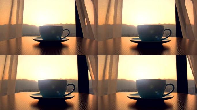 带日落背景的杯咖啡
