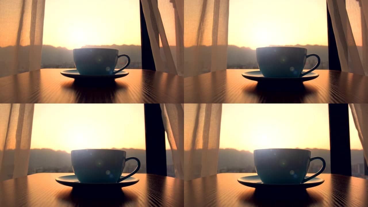 带日落背景的杯咖啡