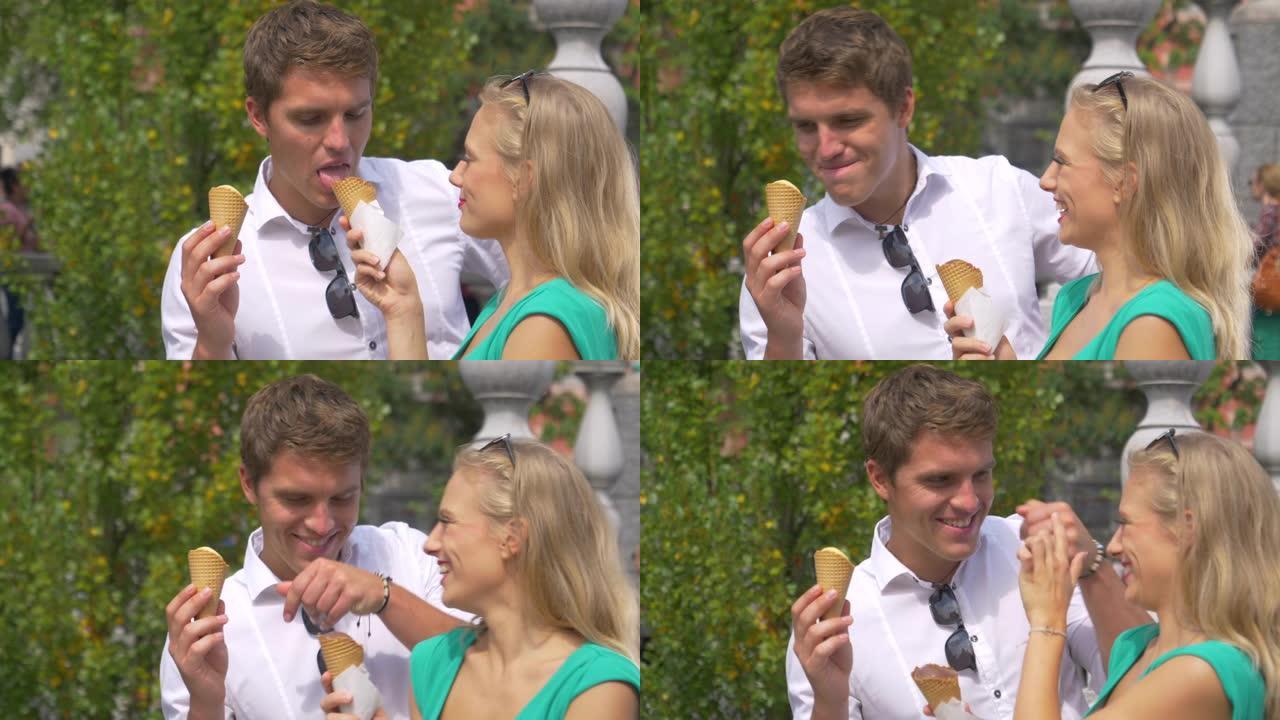 慢动作: 愚蠢的年轻女子将男友的鼻子浸入她的冰淇淋蛋筒中。