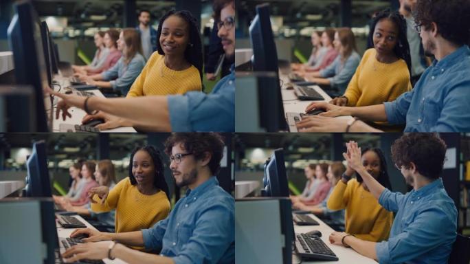 大学图书馆: 聪明的黑人女孩和聪明的西班牙裔男孩在成功完成后，一起在计算机上工作，聊天，讨论课堂分配