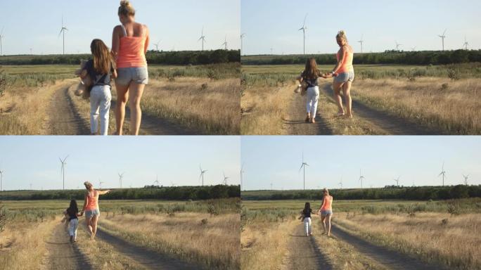 母女走在小路上母女走在小路上风车