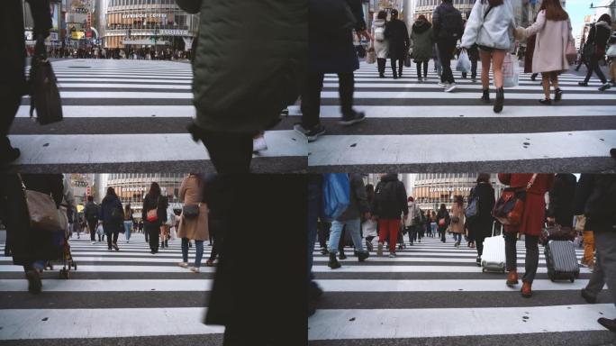 日本东京都涩谷区交通高峰时段交通路口和人群行人步行立交桥的4k镜头场景。日本文化和购物区概念