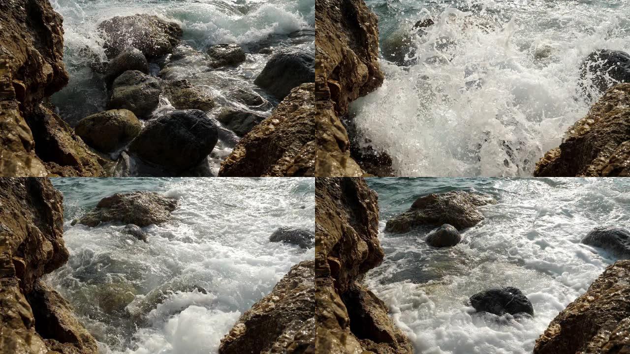 海浪撞击石滩。浪花礁石