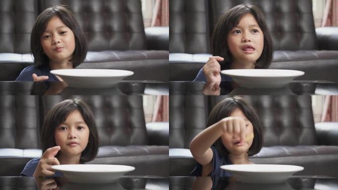 亚洲年轻女孩喜欢在家吃薯片