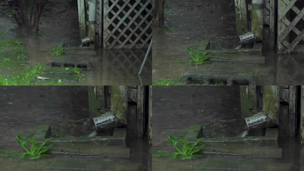 雨季雨水从房屋排水管中倾泻而出