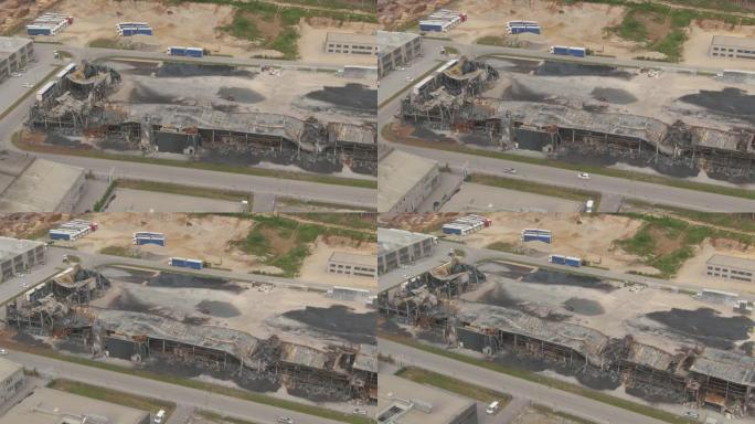 无人机: 工厂废墟在一场大火中被毁后的黯淡景象。