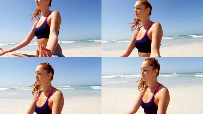 女人在阳光明媚的日子在海滩上表演瑜伽4k