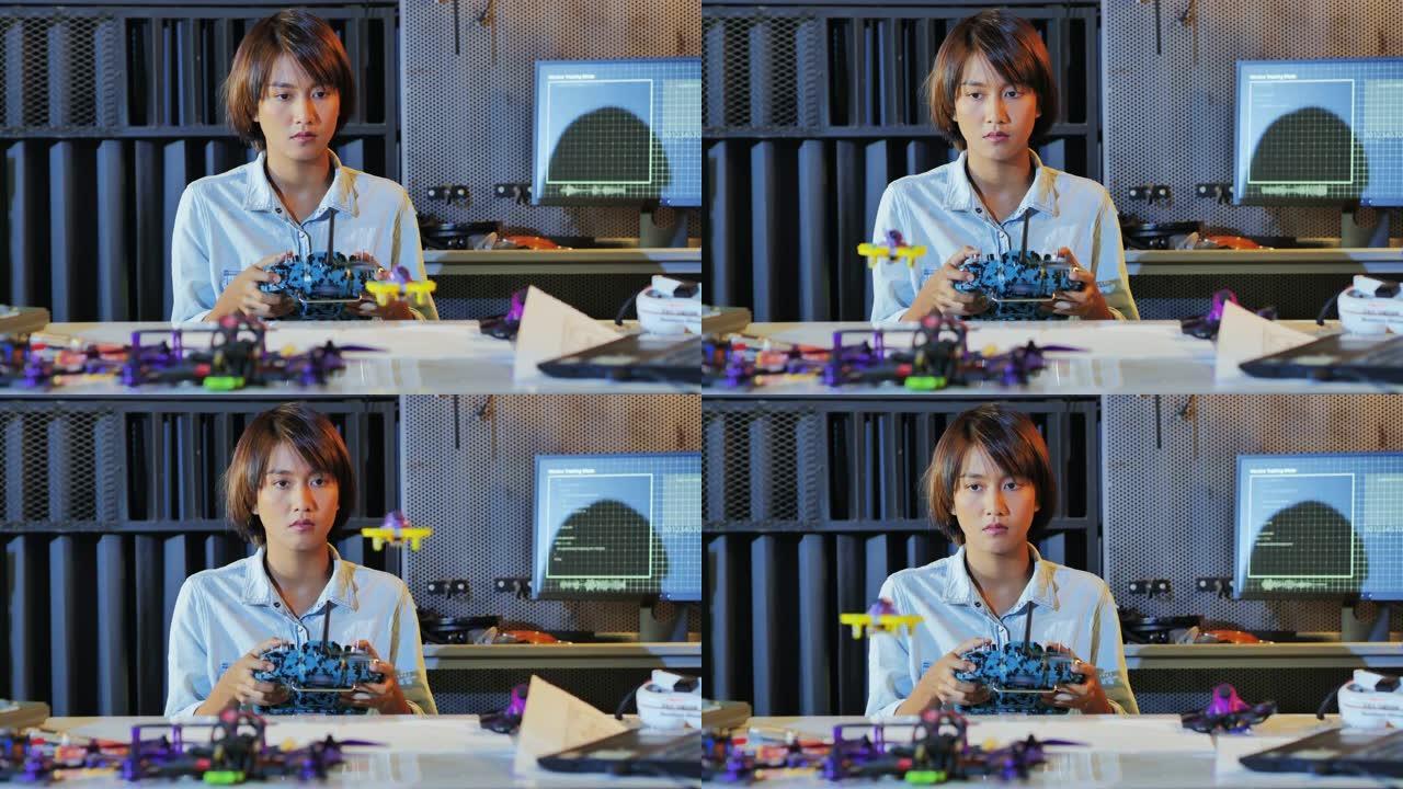 十几岁的女性在学校机器人俱乐部项目的全功能可编程机器人上工作。创意设计师在车间测试机器人原型。科学概