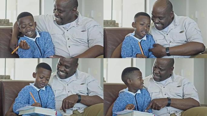 祖父和孙子在家做作业玩得开心
