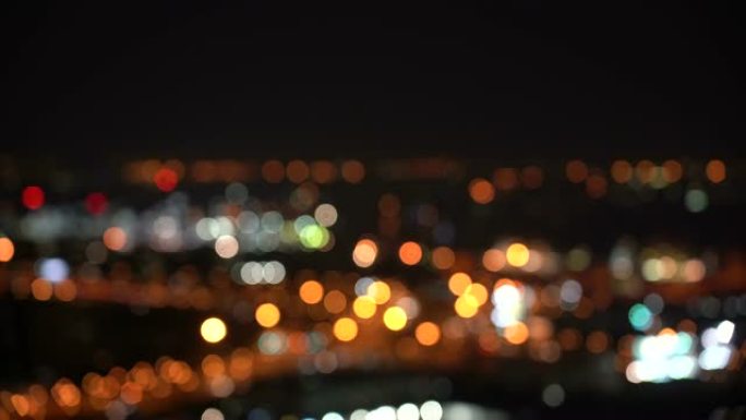 曼谷夜间bokeh的俯视图，城市景观和抽象概念从交通车和城市生活中模糊散焦光的4k镜头