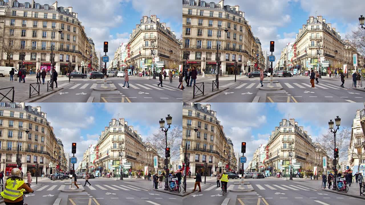 巴黎的城市街道。旧建筑，汽车，行人走过。