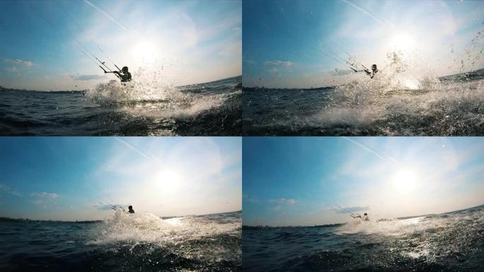 一个人在风筝冲浪时，水在飞溅