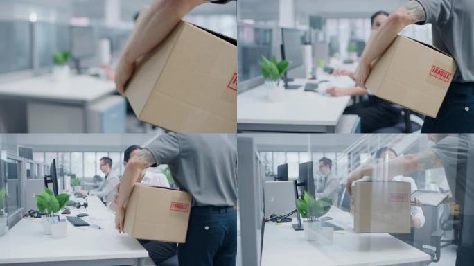 送货员进入公司办公室，将包裹交给一位美丽的女商人，她在平板电脑上签名。大光明现代商业公司办公室，专业