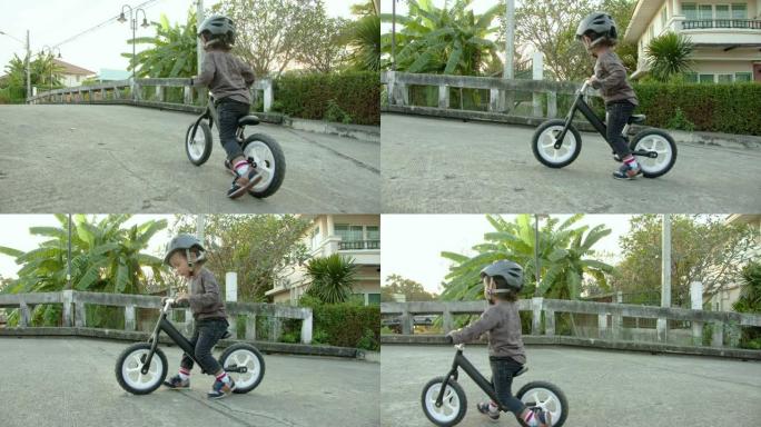 幼儿骑平衡自行车。