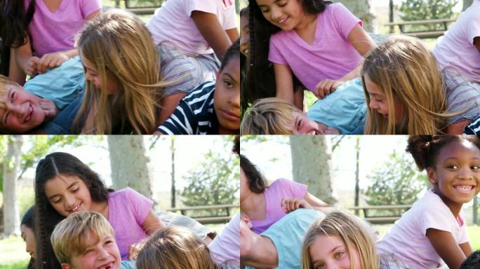 一群与朋友在公园玩耍的孩子的肖像以慢动作拍摄